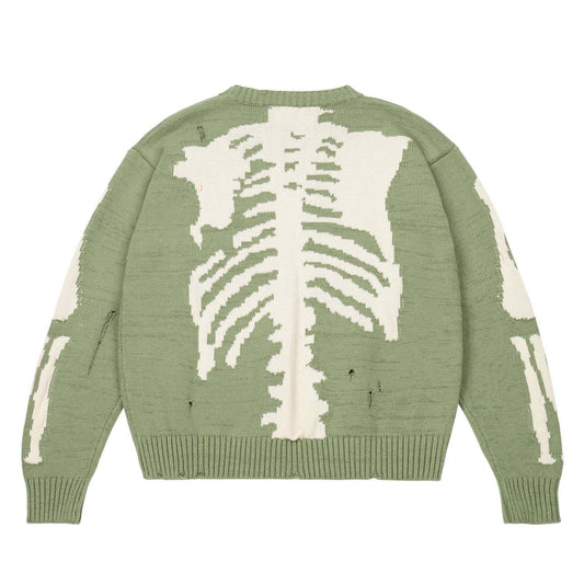 Pull vert avec motif de squelette