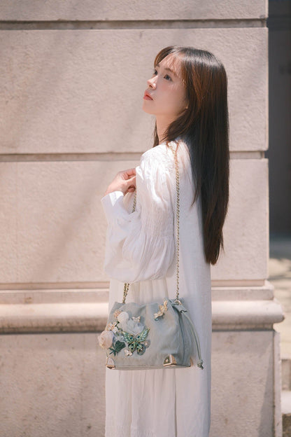 Sac seau à motifs floraux et papillons