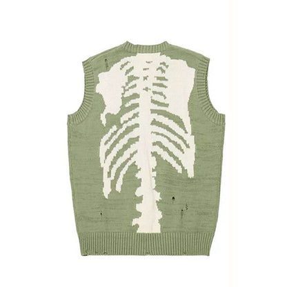 Pull vert avec motif de squelette