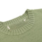 Pull vert avec motif de squelette