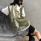 Pull vert avec motif de squelette